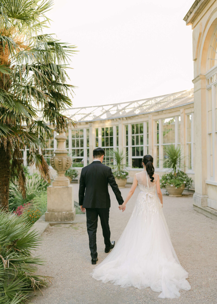 8_chloe-winstanley-weddings-syon-park-elie-saab-couple-conservatory-walking.jpg