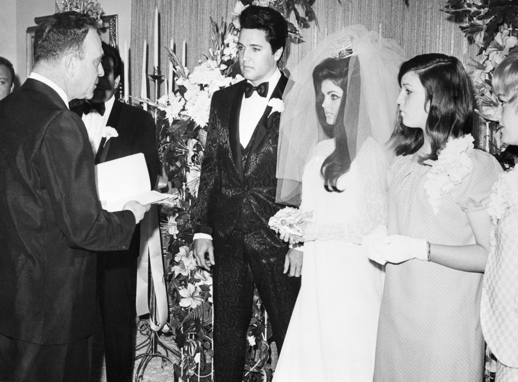 elvis-presley-and-his-bride-the-former-priscilla-ann-beaulieu-are-pronounced-man-and-wife-by-nevada-supreme-court-justice-david-zenoff-at-the-aladdin-hotel-getty.jpg