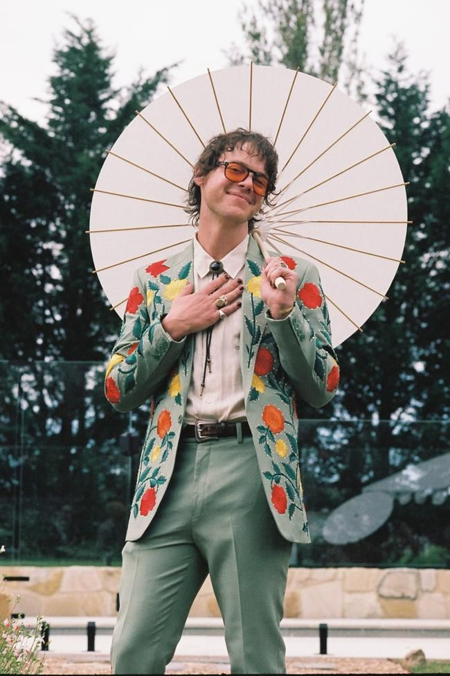 25_This bride wore a hooded cape for her 1960s-inspired, psychedelic garden wedding.jpg