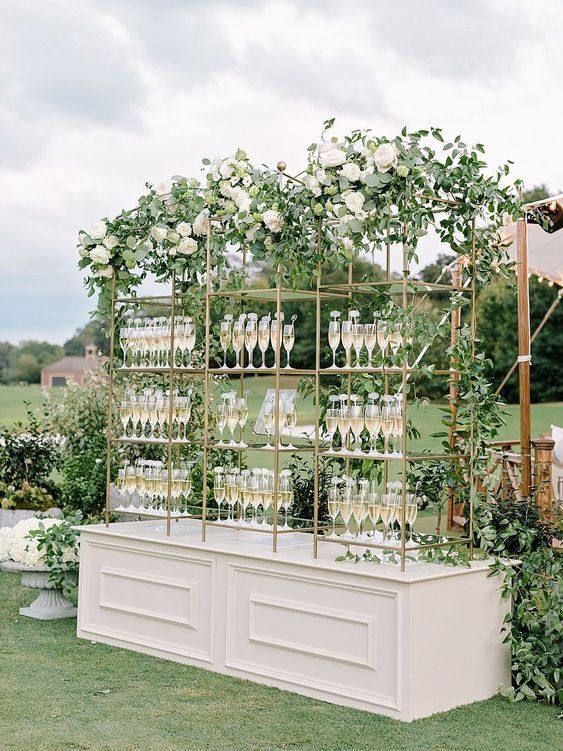 54_Opt for a champagne wall to welcome your guests at your elegant wedding reception.jpg