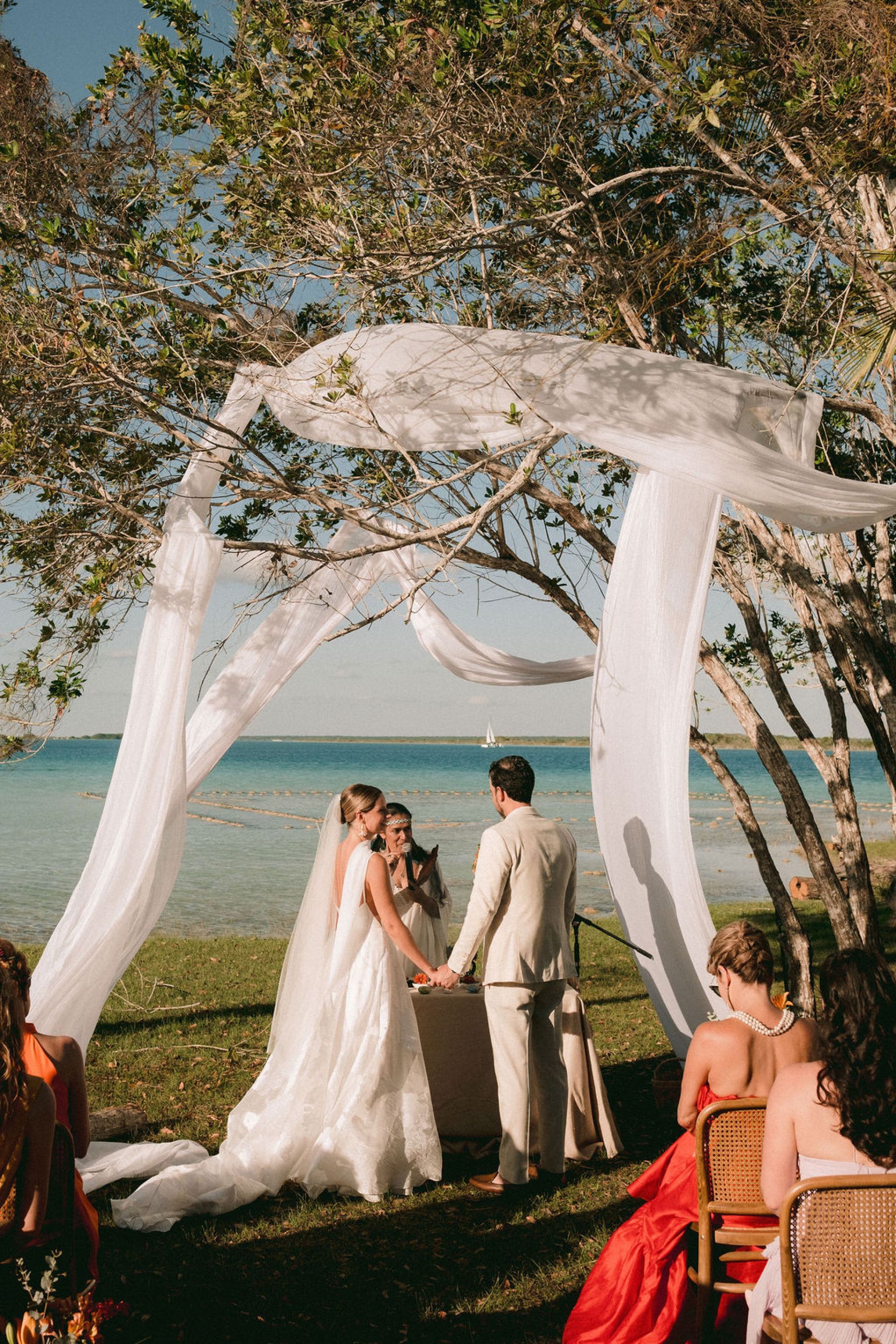 Thirteen Nationalities, a Shaman, and Seven Shades of Blue: Pauline &amp; Marsilio's Wedding at Bacalaria in Bacalar photo