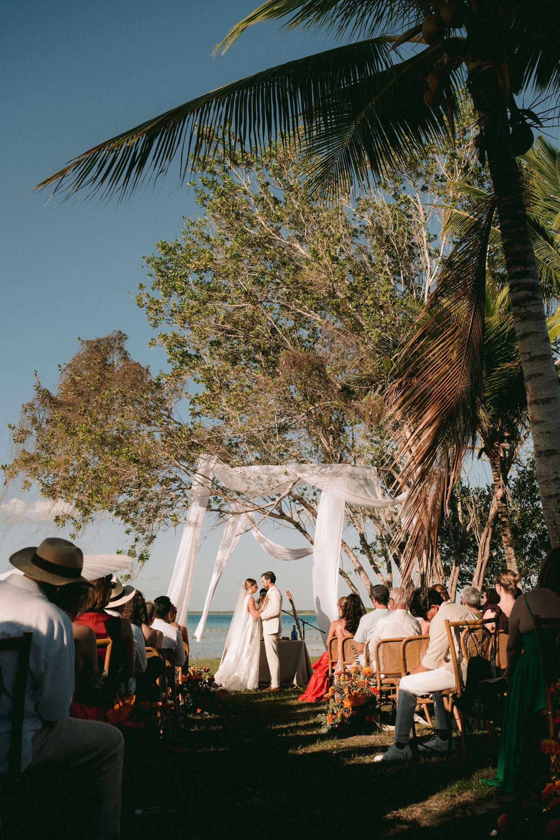 Thirteen Nationalities, a Shaman, and Seven Shades of Blue: Pauline &amp; Marsilio's Wedding at Bacalaria in Bacalar photo