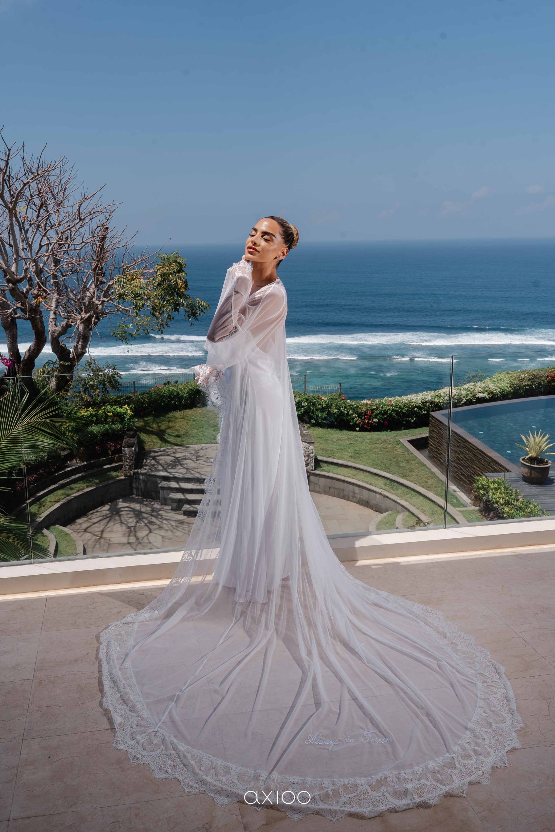 A Floating Stage, Paragliders Overhead and 100 Guests Who Flew Across the World: Karen &amp; Joey's Wedding at Pandawa Cliff Estate photo