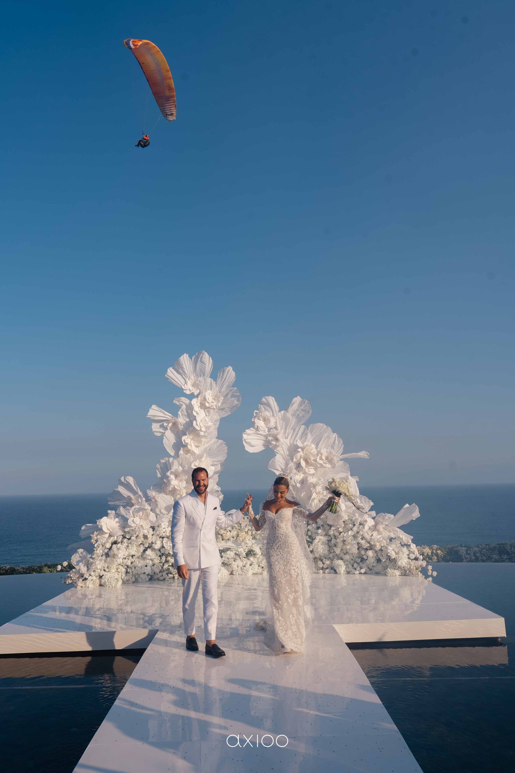 A Floating Stage, Paragliders Overhead and 100 Guests Who Flew Across the World: Karen &amp; Joey's Wedding at Pandawa Cliff Estate photo